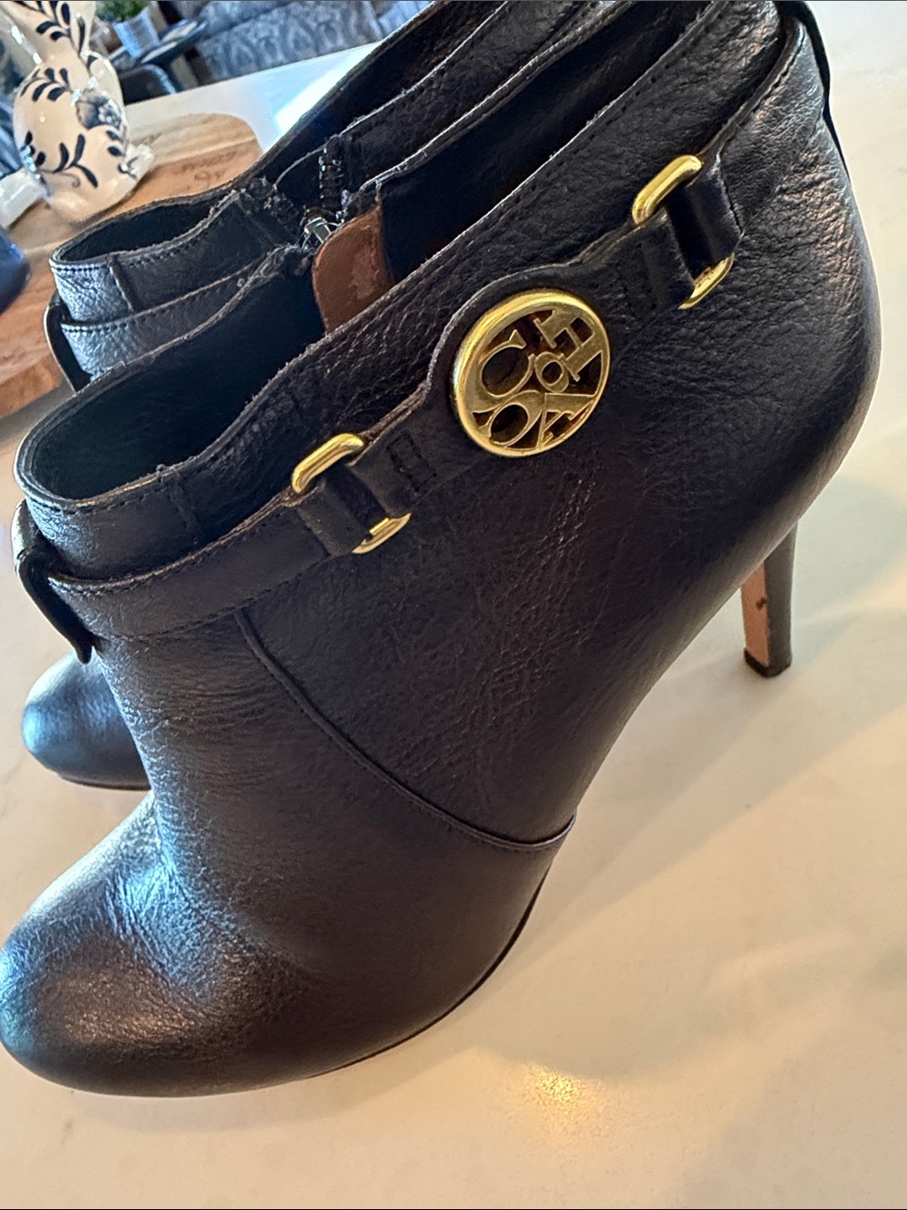 Coach Black Leather Ankle Booties with Gold Logo Accent